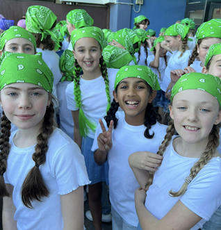 Group of students wearing green bandanas at southern stars.